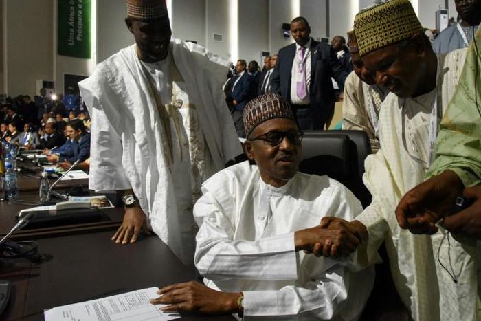 Nigerian President Muhammadu Buhari signs onto the landmark African trade deal at the AU summit in Niamey