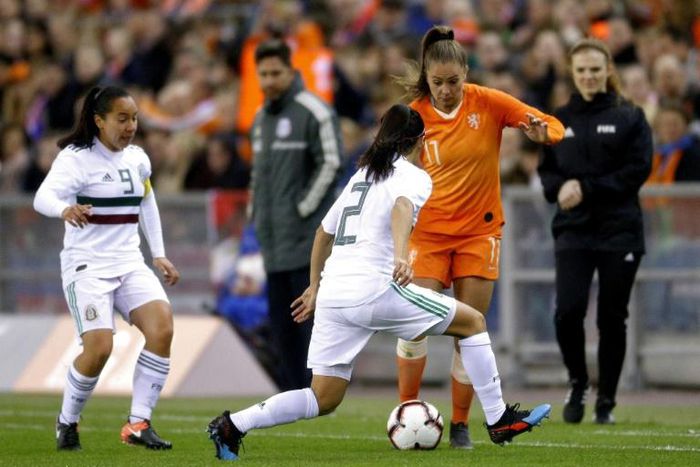 Lieke Martens (R) in action against Mexico. The Barcelona player starred in the Dutch team that won Euro 2017 as hosts