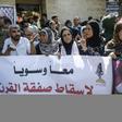 Paletinians in Gaza City hold banners denouncing the US-led Peace to Prosperity conference in Bahrain