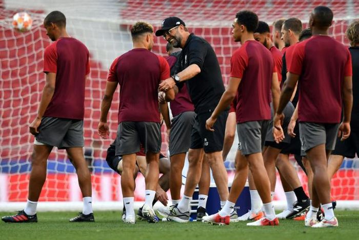 Jurgen Klopp with his players as they trained at the Metropolitano Stadium on Friday