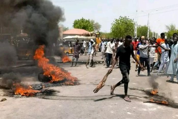 An illustrative photo of some angry mob/youths burning vehicle tyres (Punch)