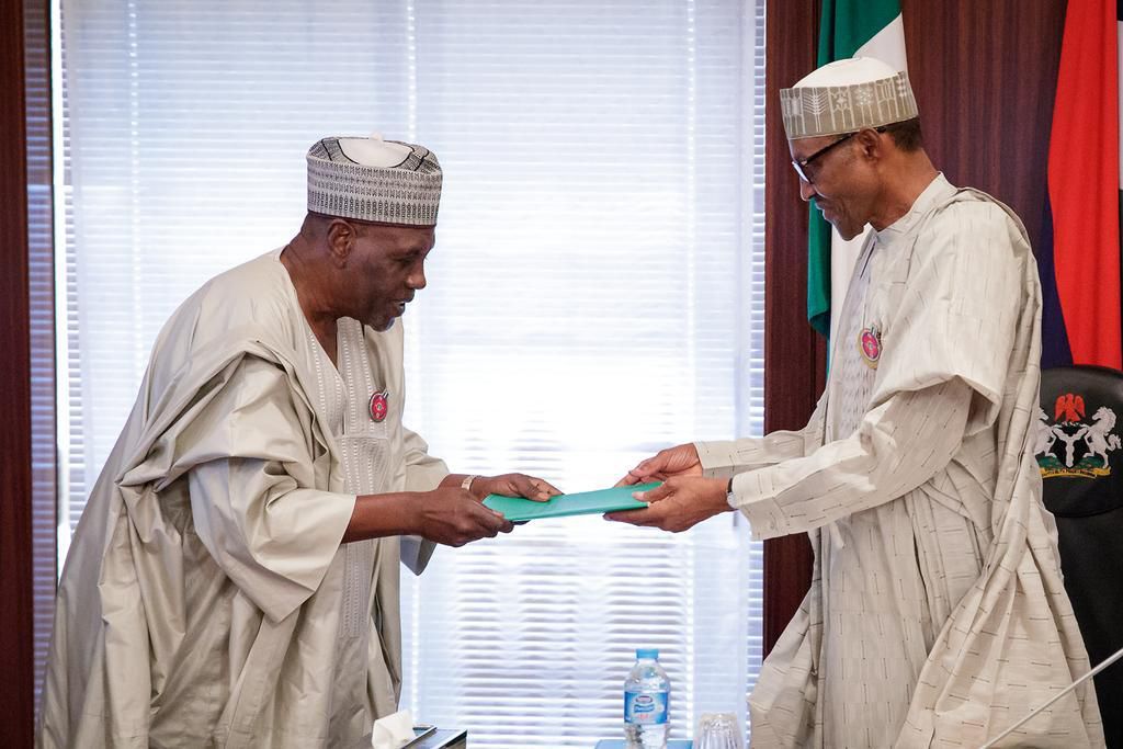 President Muhammadu Buhari receives the report of the Presidential Review Panel on National Intelligence Agency (NIA) from former Minister of Foreign Affairs, Ambassador Babagana Kingibe at the Presidential Villa on Tuesday, December 19, 2017