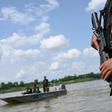 An armed Thai navy personnel patrols along the Mekong river in Nakhon Phanom province, where drug gangs ship meth from Laos to Thailand