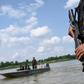 An armed Thai navy personnel patrols along the Mekong river in Nakhon Phanom province, where drug gangs ship meth from Laos to Thailand