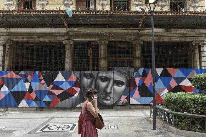 Across the city, damage from the economic slowdown is still evident: abandoned or dilapidated buildings, shuttered shops, broken sidewalks
