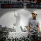 A man stands in front of a photo from the 1989 Tiananmen Square protests at a museum in Hong Kong