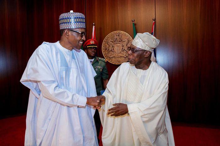 President Muhammadu Buhari shakes hands with former president, Olusegun Obasanjo
