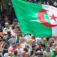 Algerians carry a protester on a stretcher at a weekly demonstration on July 5, 2019. Algerian police have opened an investigation after a video circulated online appeared to show protesters being beaten by security forces