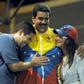 In this 2013 photo, Venezuelan acting President Nicolas Maduro (C) embraces his wife Cilia Flores (R) and son Nicolas Maduro during a campaign rally -- Maduro's son is now the target of US economic sanctions