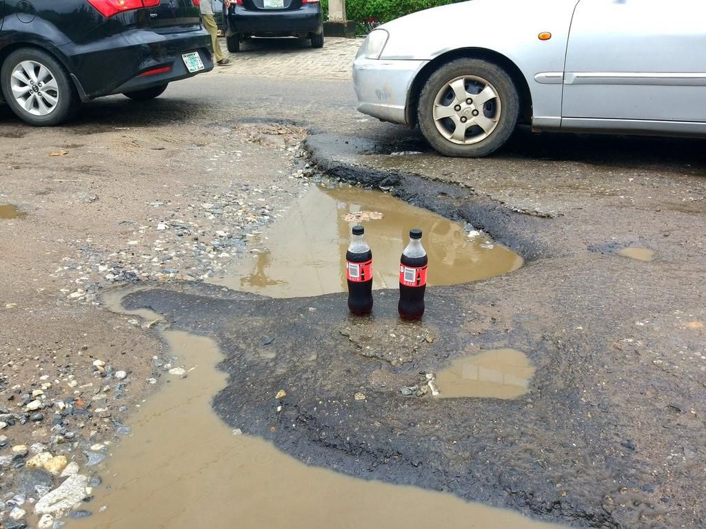 ‘Generous’ lawyer throws party for potholes in front of Zenith Bank for getting “bigger and deeper”