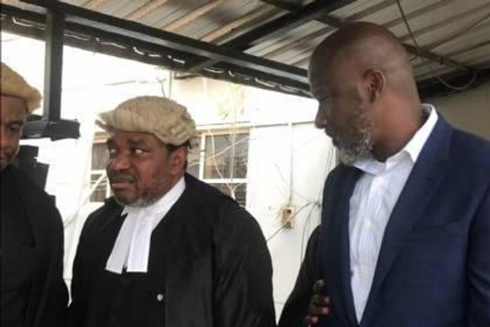 Mr Dele BElgore with his lawyers
