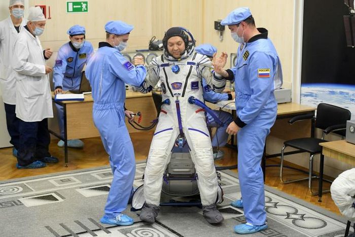 Oleg Kononenko, shown here being prepped for the December 3 launch, is a veteran cosmonaut on his fourth mission. He is set to reach 737 days by the time he returns to Earth on Tuesday  