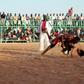 In this file photo from 2013, Japanese diplomat Yasuhiro Murotatsu, aka "Muro" (R) competes against Saleh Omar Bol Tia Kafi aka "al-Mudiriya" in a Nuba wrestling match in Khartoum
