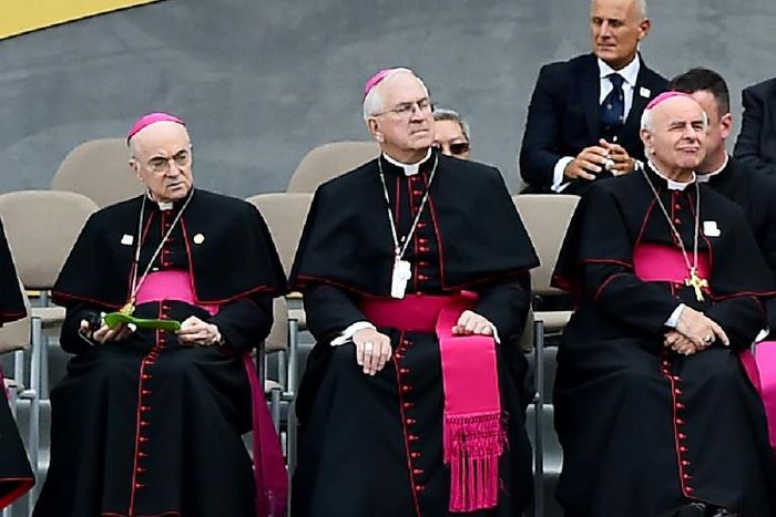 Carlo Maria Vigano (L), the former Vatican ambassador to the United States, with other prelates as they listen to a speech by Pope Francis in Philadelphia on September 25, 2015
