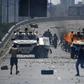 Supporters of Venezuelan opposition leader and self-proclaimed acting president Juan Guaido clash with forces loyal to President Nicolas Maduro in front of La Carlota military base in Caracas on April 30, 2019