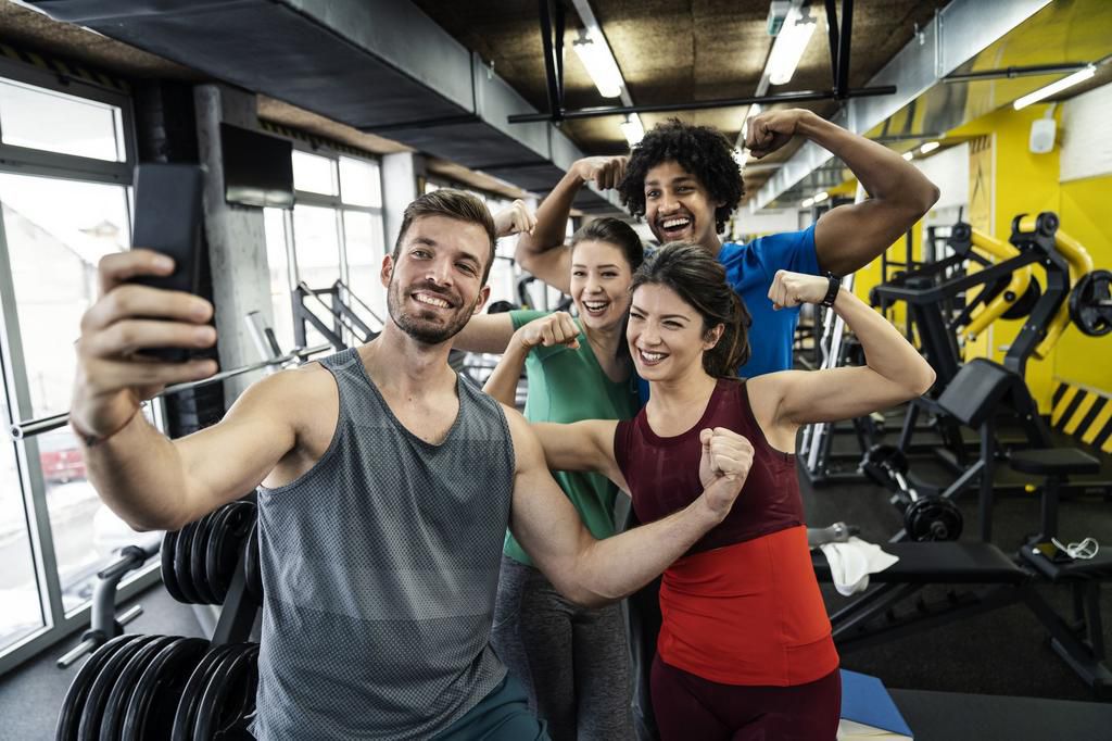 Athletic friends taking a selfie at the gym