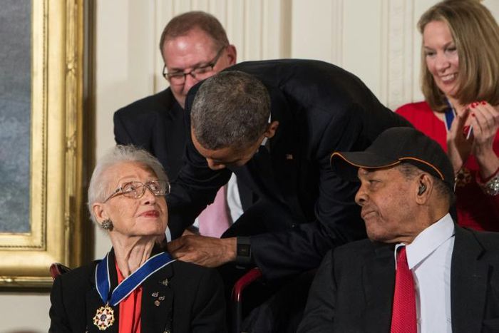 Katherine Johnson, seen here receiving the Presidential Medal of Freedom from Barack Obama, provided pivotal contributions to American space flight research alongside Dorothy Vaughan and Mary Jackson