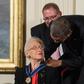 Katherine Johnson, seen here receiving the Presidential Medal of Freedom from Barack Obama, provided pivotal contributions to American space flight research alongside Dorothy Vaughan and Mary Jackson