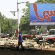 Fewer people than usual were on the streets of Khartoum, patrolled by heavily armed paramilitaries