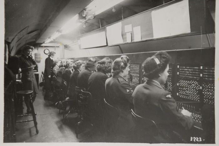 A reproduction of a black and white photograph taken in 1944 and shown to AFP by former D-Day switchboard operator Marie Scott, shows women at work in the tunnels at Fort Southwick in Portsmouth, southern England.
