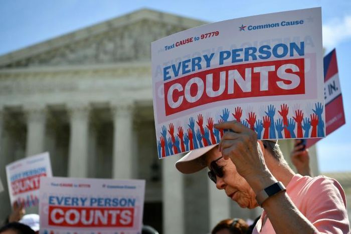 Protesters outside the Supreme Court demonstrate against adding a citizenship question to the US census