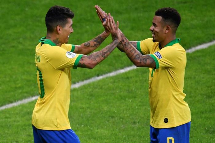 Roberto Firmino (left) and Gabriel Jesus celebrate their goals that sent Brazil into the Copa America final at arch rivals Argentina's expense