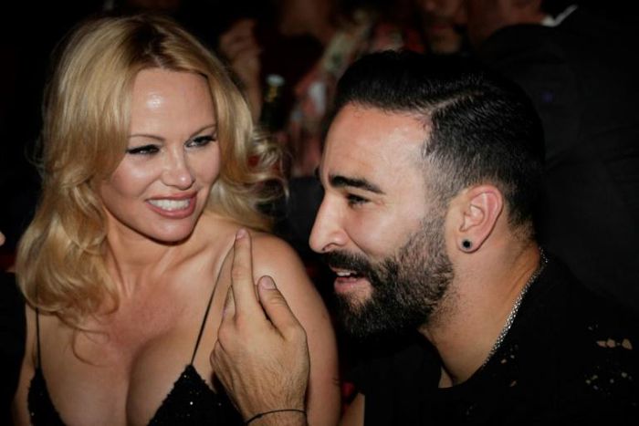 Pamela Anderson and France World Cup-winning player Adil Rami at the Crazy Horse cabaret in Paris on June 3