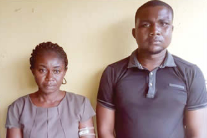 Ajeminie Douglas and Sunny after their arrest (Punch)