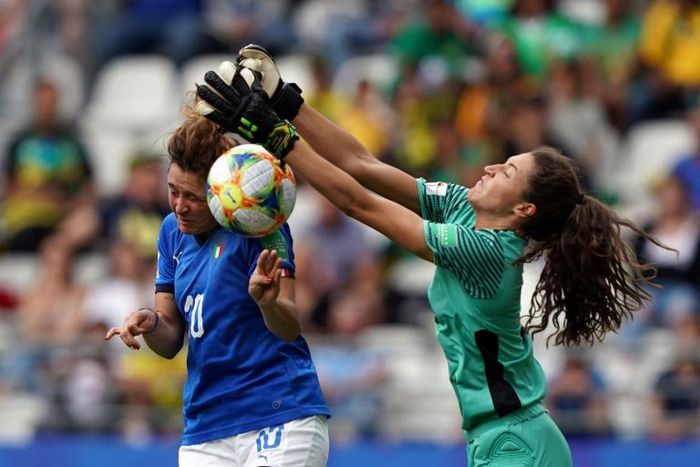 Italy's Cristiana Girelli scores despite the efforts of Jamaica goalkeeper Sydney Schneider
