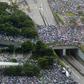 Tens of thousands attended a rally to support Hong Kong's leadership amid the city's biggest political crisis in decades