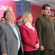 This handout photo from Venezuela's presidential press office shows President Nicolas Maduro (C) flanked by his wife Cilia Flores (L) and Defense Minister Vladimir Padrino (R) in Caracas on August 4, 2019