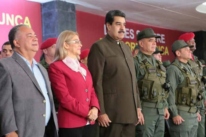 This handout photo from Venezuela's presidential press office shows President Nicolas Maduro (C) flanked by his wife Cilia Flores (L) and Defense Minister Vladimir Padrino (R) in Caracas on August 4, 2019