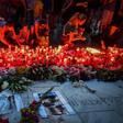 Protesters placed flowers and candles at a makeshift memorial outside the interior ministry in the capital Bucharest on Saturday evening