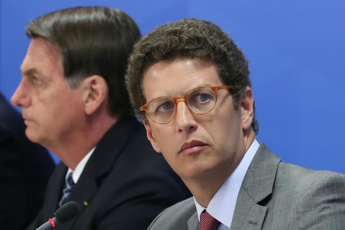 Brazil's Environment Minister Ricardo Salles (R), speaking next to Brazilian President Jair Bolsonaro in this photo provided by the Brazilian Presidency, has doubted deforestation data
