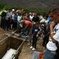 Relatives and friends of Erick Altuve attend his funeral