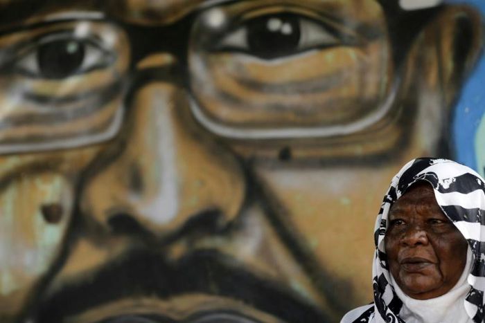 Maiyssa Omar says the painting of her son Walid Abdelrahim who was shot dead during protests last month 'keeps him alive'