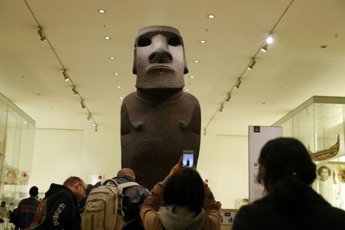 A sacred statue known as Hoa Hakananai'a stands at the entrance to a gallery in the British Museum in London