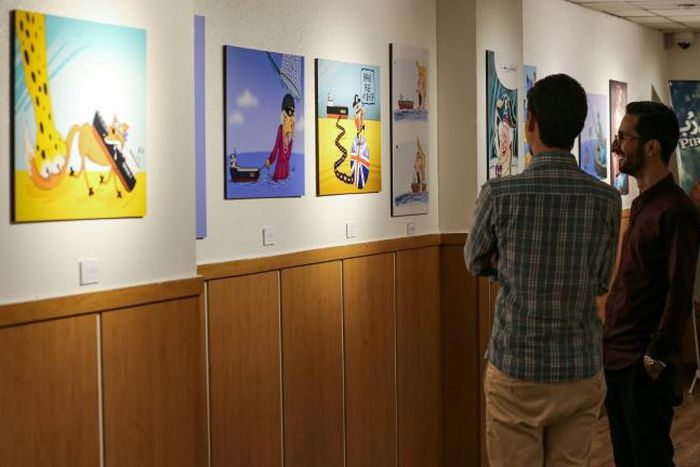 The "Pirates of the Queen" cartoon exhibition in Tehran portrays Britain's Queen Elizabeth II as a "pirate" over the seizure of an Iranian oil tanker off Gibraltar