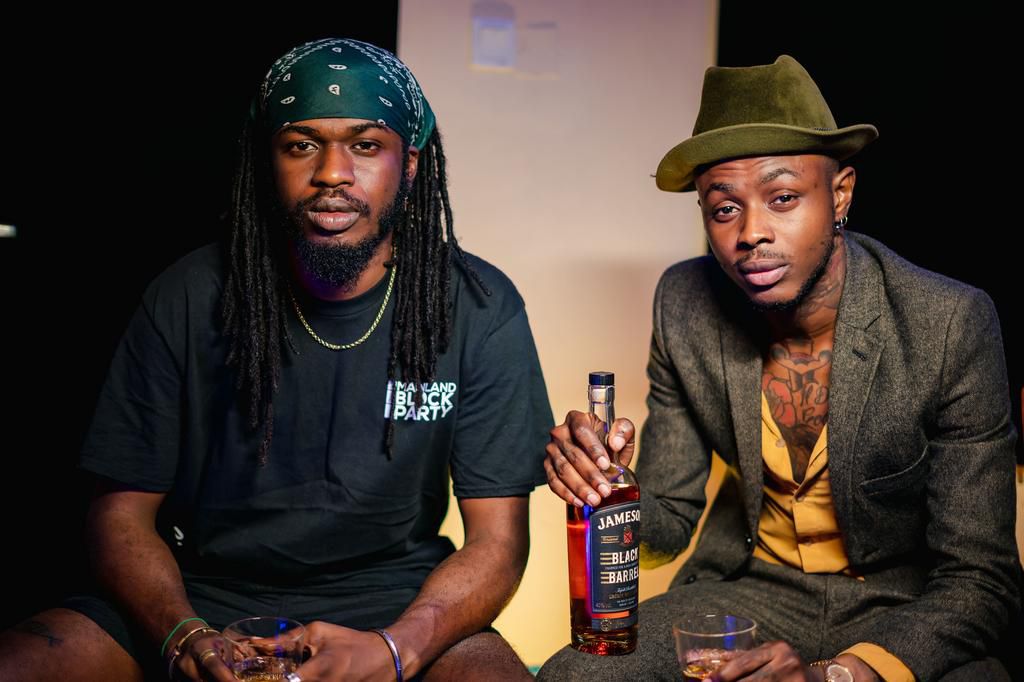 BOJ AND ALANI ADENLE receIving Jameson Black Barrel gift