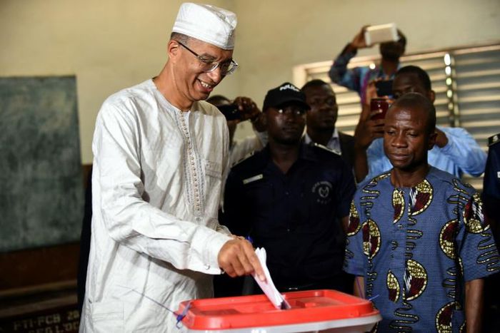 Former prime minister Lionel Zinsou (L), who lives in France, was found guilty of using false documents and "exceeding" spending limits in his 2016 presidential bid