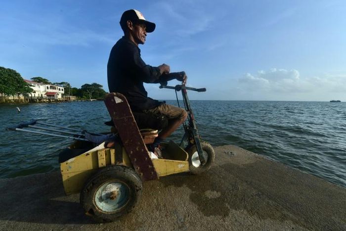 A disabled diver watches the sea in Puerto Lempira, Honduras: thousands of lobster divers end up disabled from a lack of proper equipment or medical follow-up for decompression sickeness