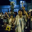 Overnight, a group of around 2,000 protestors held a vigil outside the government offices, with some singing hymns
