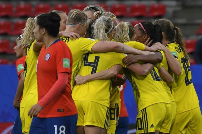 Sweden scored two late goals to beat Chile after a lengthy delay in their game due to a storm