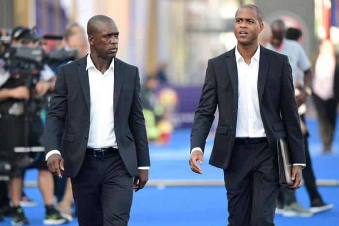 Clarence Seedorf and his assistant Patrick Kluivert arrive for the match against Nigeria in Africa Cup of Nations round of 16, their last in charge of Cameroon