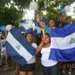 Friends and neighbours celebrate after student leader Edwin Carcache (not pictured) was released from prison, in Managua on June 11, 2019