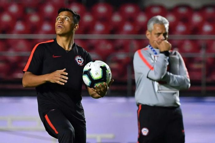 Chile coach Reinaldo Rueda (right) must decide whether or not to play Alexis Sanchez in Monday's clash with Uruguay