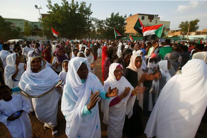 Sudanese women applauded on Saturday in celebration of a power sharing agreement between protest leaders and the ruling military council