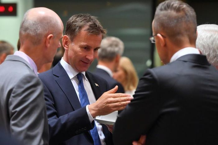 Britan's Foreign Secretary Jeremy Hunt (2nd L) talks with his counterparts Stef Blok (L) from the Netherlands and Jacek Czaputowicz (R) from Poland at a meeting in Brussels. Hunt has warned that the "small window" left to save the Iran nuclear deal was...