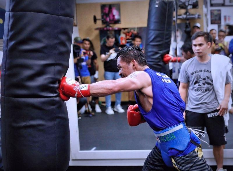 Pacquiao taking it to the heavy bag in the gym portion of his training.