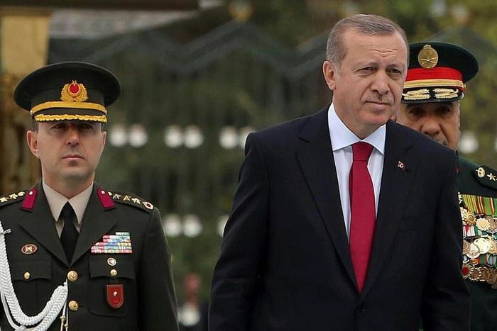 The court handed down an aggravated life sentence for "violating the constitution" to Colonel Ali Yazici (L), former military aide to Erdogan (R)